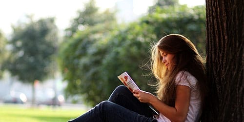 Woman reading pamphlet